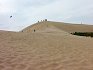 Skalnaté pobřeží vystřídaly písčité duny.